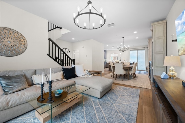 living room featuring dark hardwood / wood-style floors and a chandelier