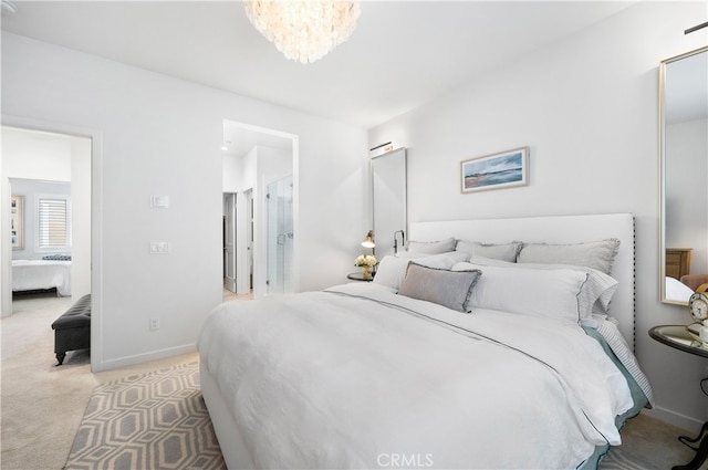 bedroom with a chandelier and light carpet