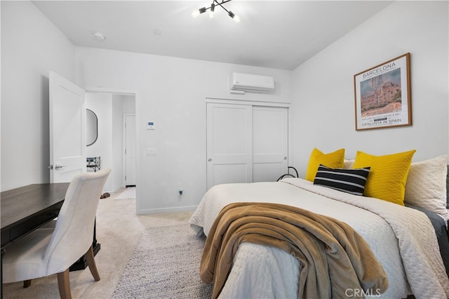 carpeted bedroom with a wall mounted air conditioner and a closet