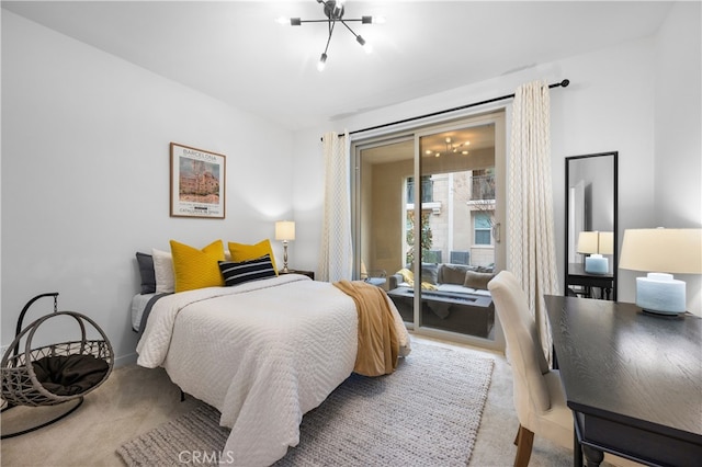 bedroom with carpet floors and access to exterior