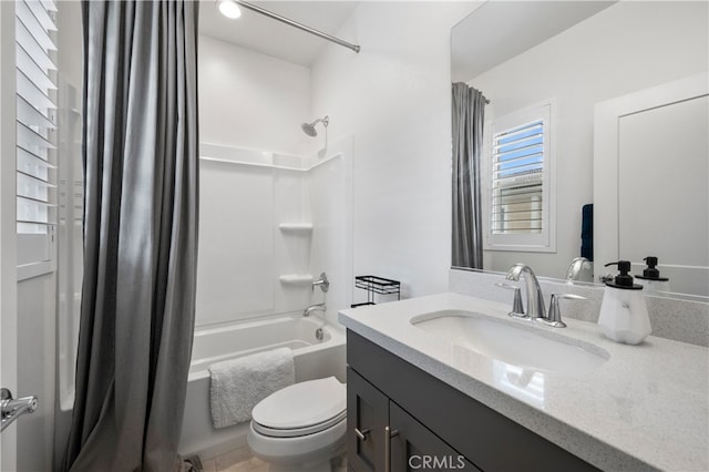 full bathroom with shower / bathtub combination with curtain, vanity, and toilet