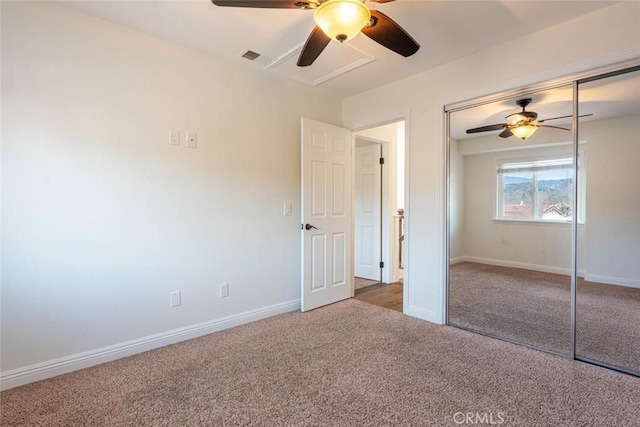 unfurnished bedroom with ceiling fan, carpet floors, and a closet