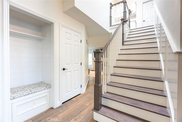 stairway featuring hardwood / wood-style floors