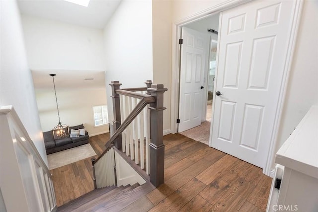 staircase featuring hardwood / wood-style flooring and a skylight