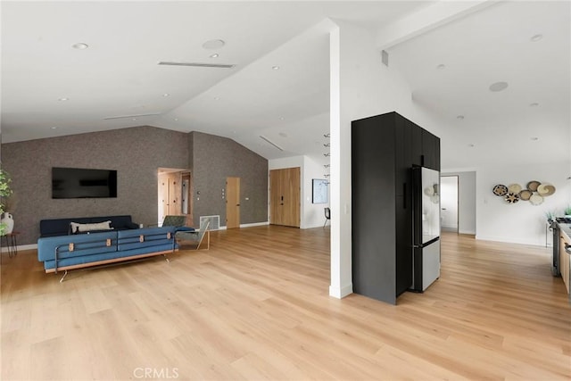 living room with lofted ceiling and light hardwood / wood-style floors