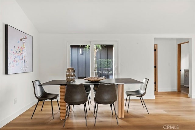 dining space featuring light wood-type flooring