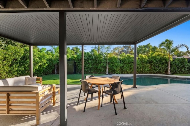 view of patio with a fenced in pool and outdoor lounge area