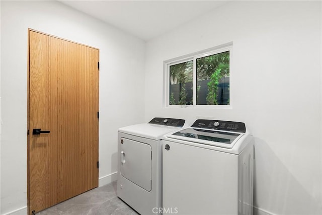 laundry room featuring separate washer and dryer