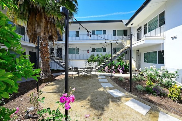 surrounding community with a patio area