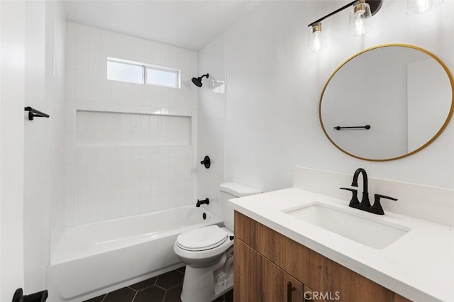 full bathroom featuring tile patterned flooring, vanity, toilet, and tiled shower / bath