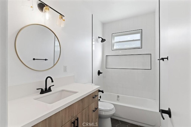 full bathroom featuring tiled shower / bath combo, vanity, tile patterned flooring, and toilet