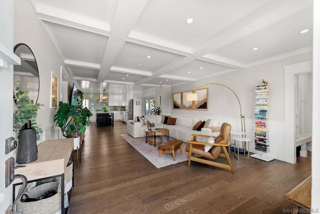 living room featuring coffered ceiling, dark hardwood / wood-style floors, ornamental molding, and beam ceiling