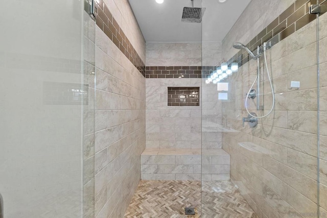 bathroom with a tile shower