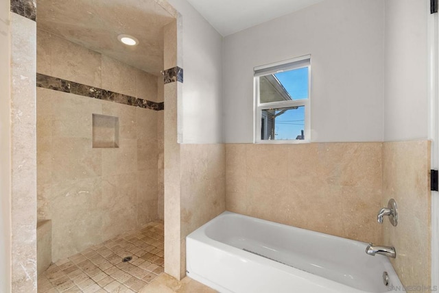 bathroom with separate shower and tub