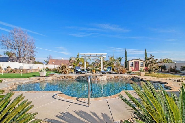 view of swimming pool featuring a pergola, a patio, and a storage unit