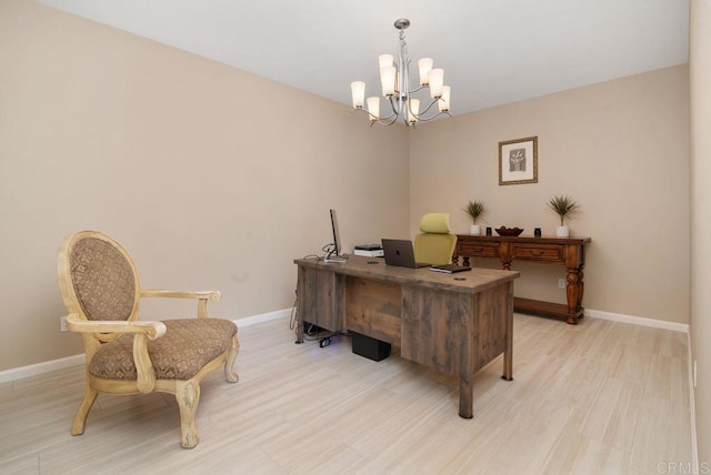 office space with an inviting chandelier and light wood-type flooring