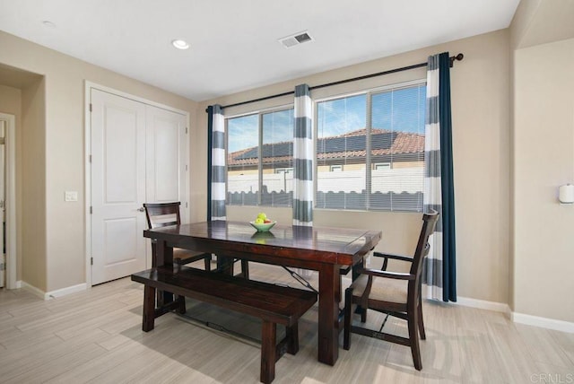 dining room with light hardwood / wood-style floors