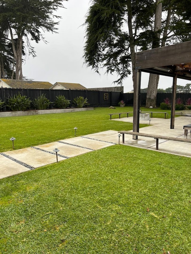 surrounding community featuring a yard and a pergola