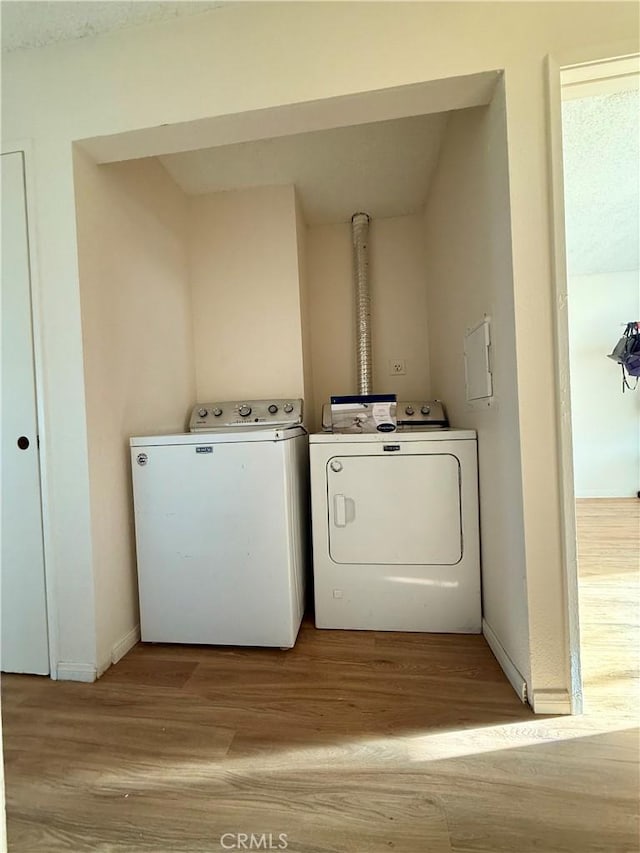 25925 Baylor Way, Hemet, CA 92544 - laundry area with independent washer and dryer, wood finished floors, and baseboards