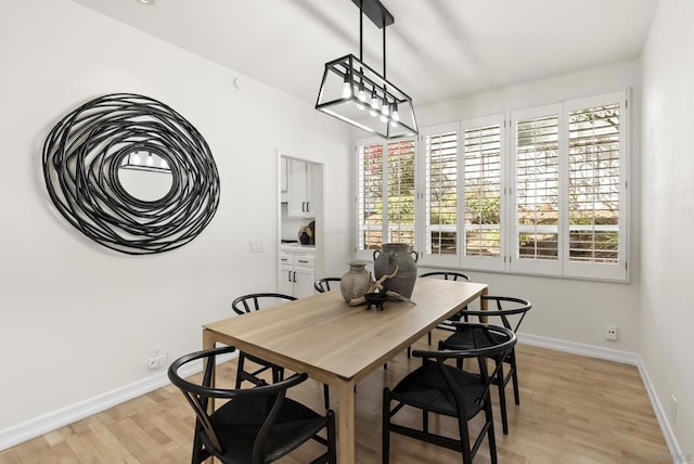 dining room with light wood-type flooring