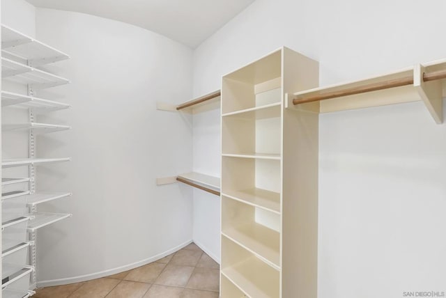 spacious closet with light tile patterned flooring