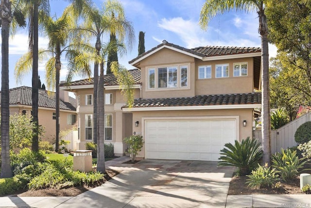 mediterranean / spanish-style house with a garage