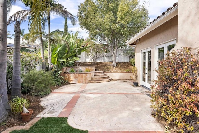 view of patio featuring french doors