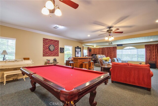 game room with ornamental molding, carpet, and a wealth of natural light