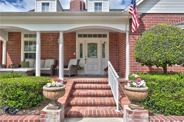 entrance to property featuring covered porch