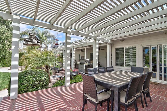 view of patio with ceiling fan and a pergola