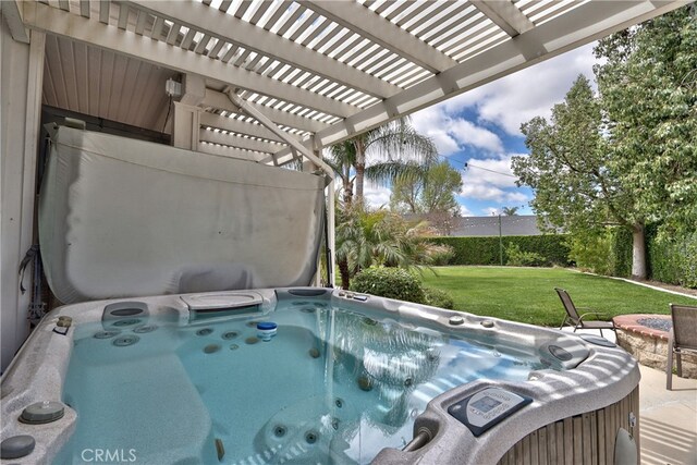 view of pool featuring a pergola, a lawn, and a hot tub