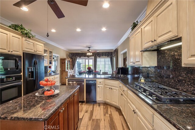 kitchen featuring sink, ornamental molding, black appliances, and kitchen peninsula