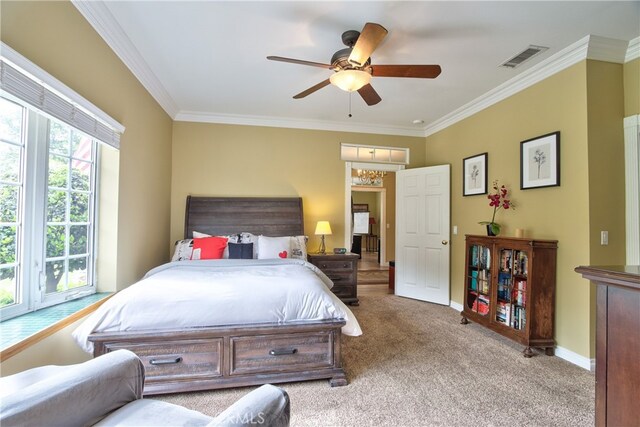 carpeted bedroom featuring crown molding and ceiling fan