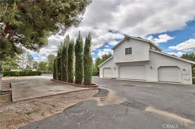 view of property exterior with a garage