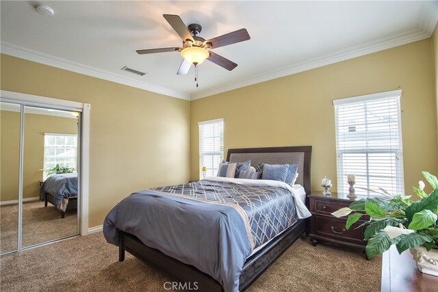 carpeted bedroom with multiple windows, crown molding, and ceiling fan