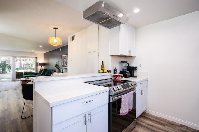 kitchen with extractor fan, decorative light fixtures, white cabinetry, stainless steel range with electric cooktop, and kitchen peninsula