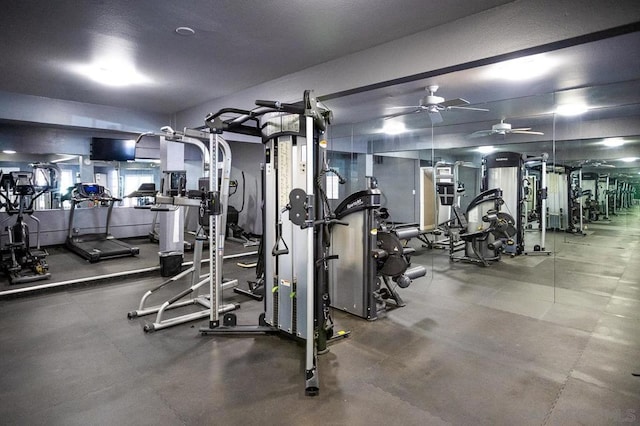 exercise room with ceiling fan