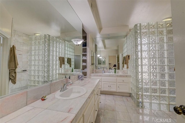 bathroom featuring vanity and a shower