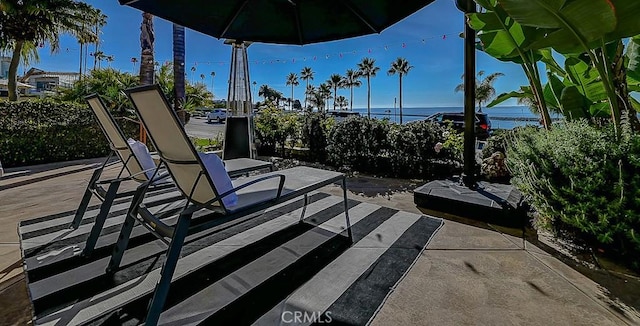 view of patio featuring a water view