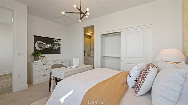 bedroom featuring light carpet and ensuite bath