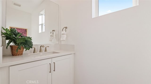 bathroom featuring vanity and a wealth of natural light