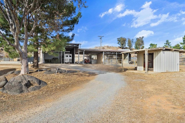 ranch-style house with an outbuilding