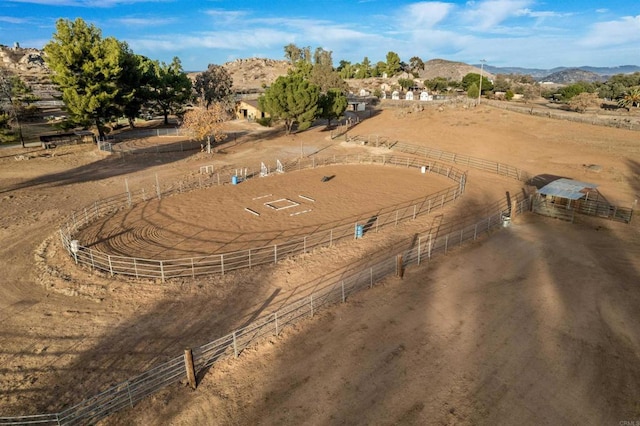 birds eye view of property featuring a rural view and a mountain view