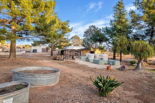 view of yard with an outdoor structure