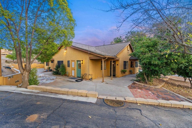 ranch-style house featuring a patio area