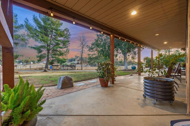 view of patio terrace at dusk