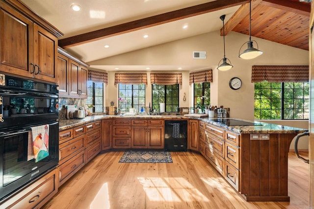 kitchen featuring stone countertops, decorative light fixtures, light hardwood / wood-style flooring, kitchen peninsula, and black appliances