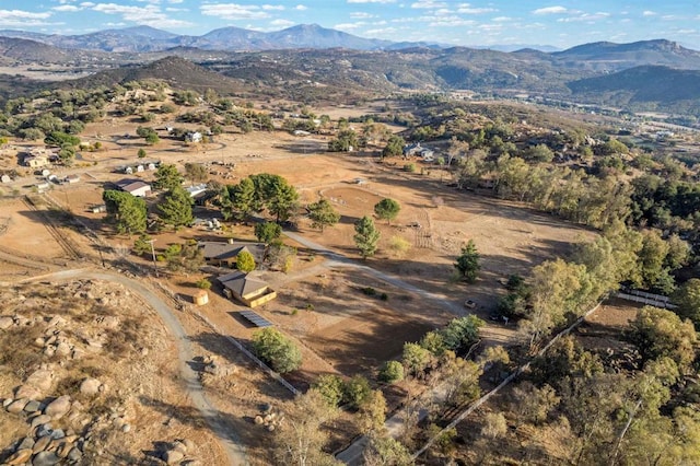 birds eye view of property with a mountain view