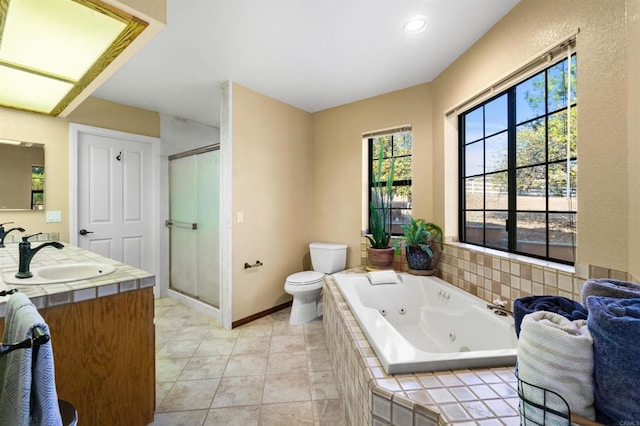 full bathroom with vanity, toilet, tile patterned flooring, and shower with separate bathtub