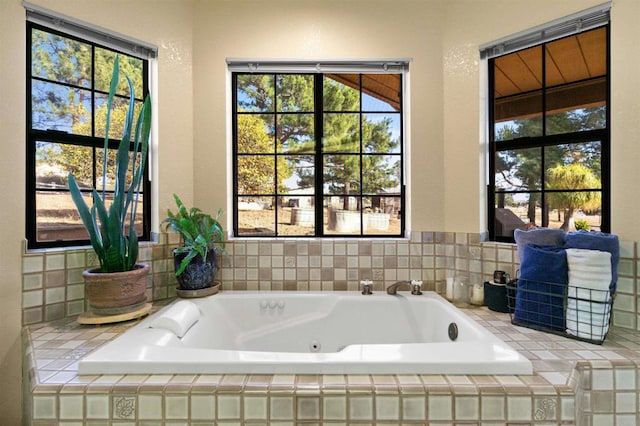 bathroom with tiled bath